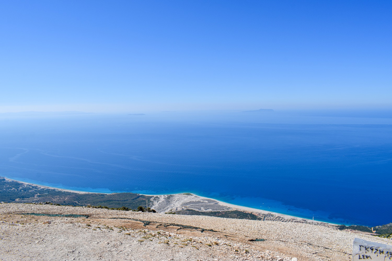 Palasa Beach on the Albanian Riviera with Greek islands in the background, viewed from Llogara Pass