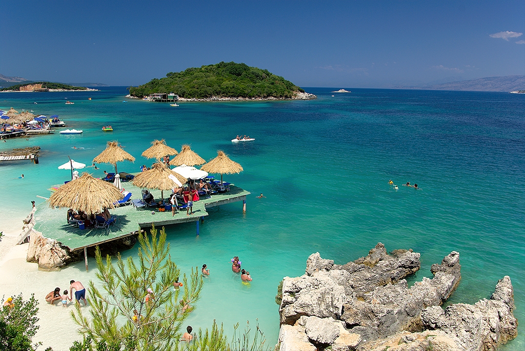 Hidden cove on the Albanian Riviera — clear turquoise water and wild rocky coastline
