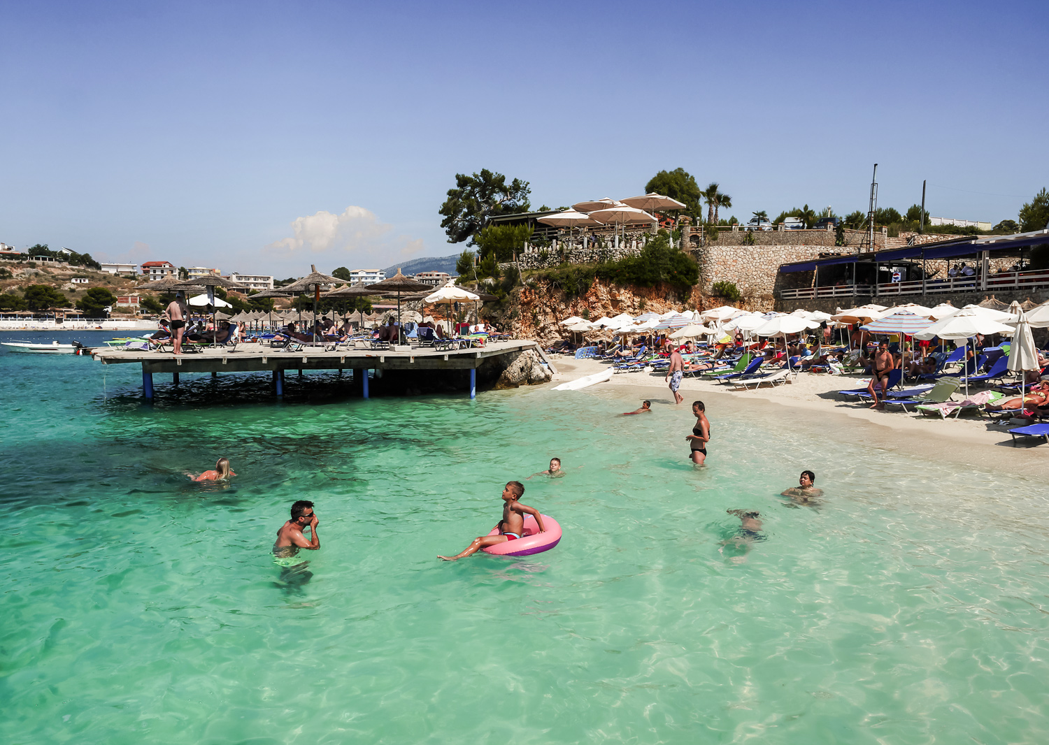 Family friendly beach in Albania — shallow clear water and wide sandy shore ideal for children
