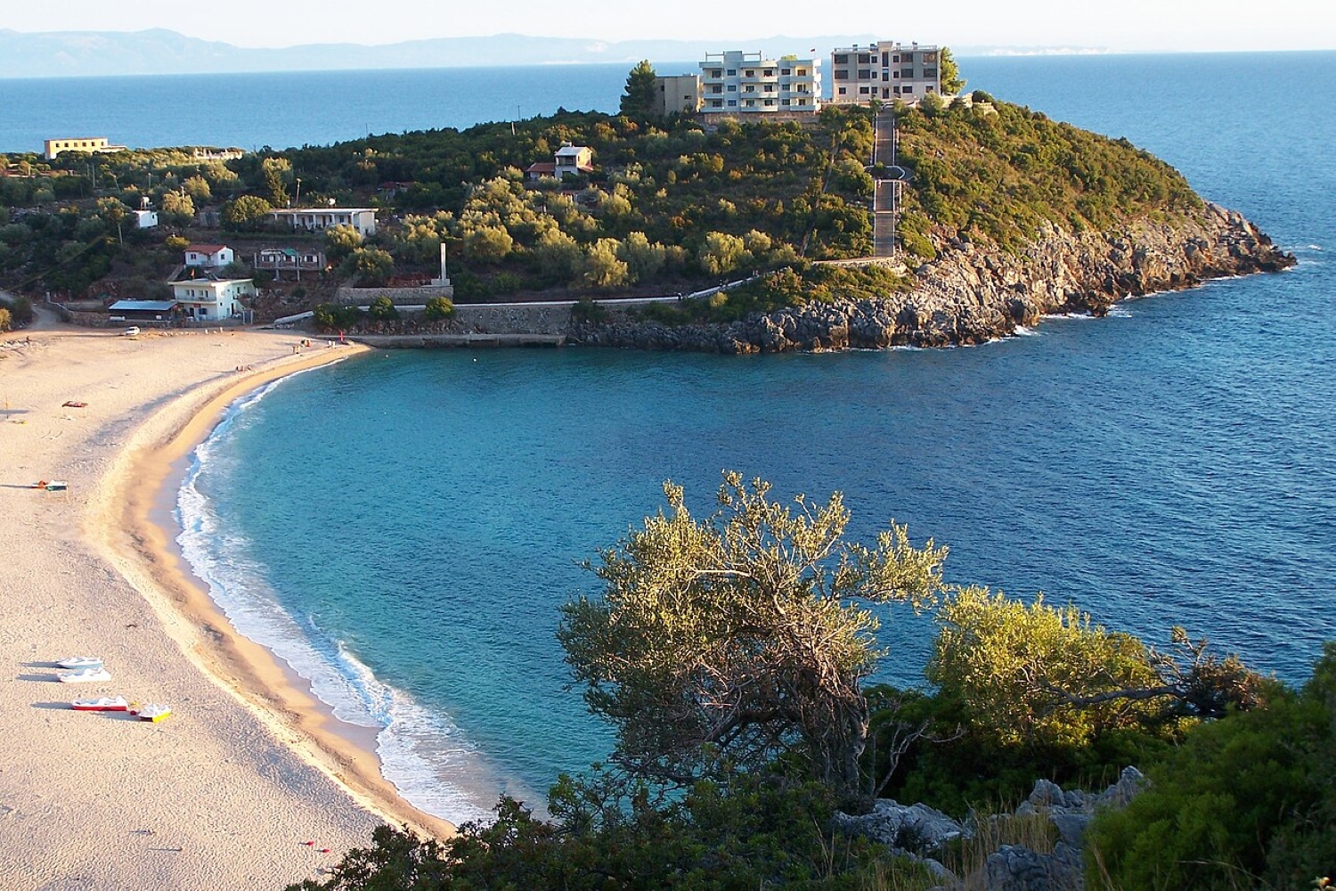 Jale Beach Albania — view of the cove with olive groves above and turquoise water below