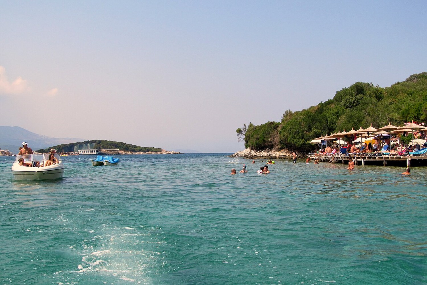 Ksamil Albania — sandy beach and offshore islands in the clear turquoise Ionian water
