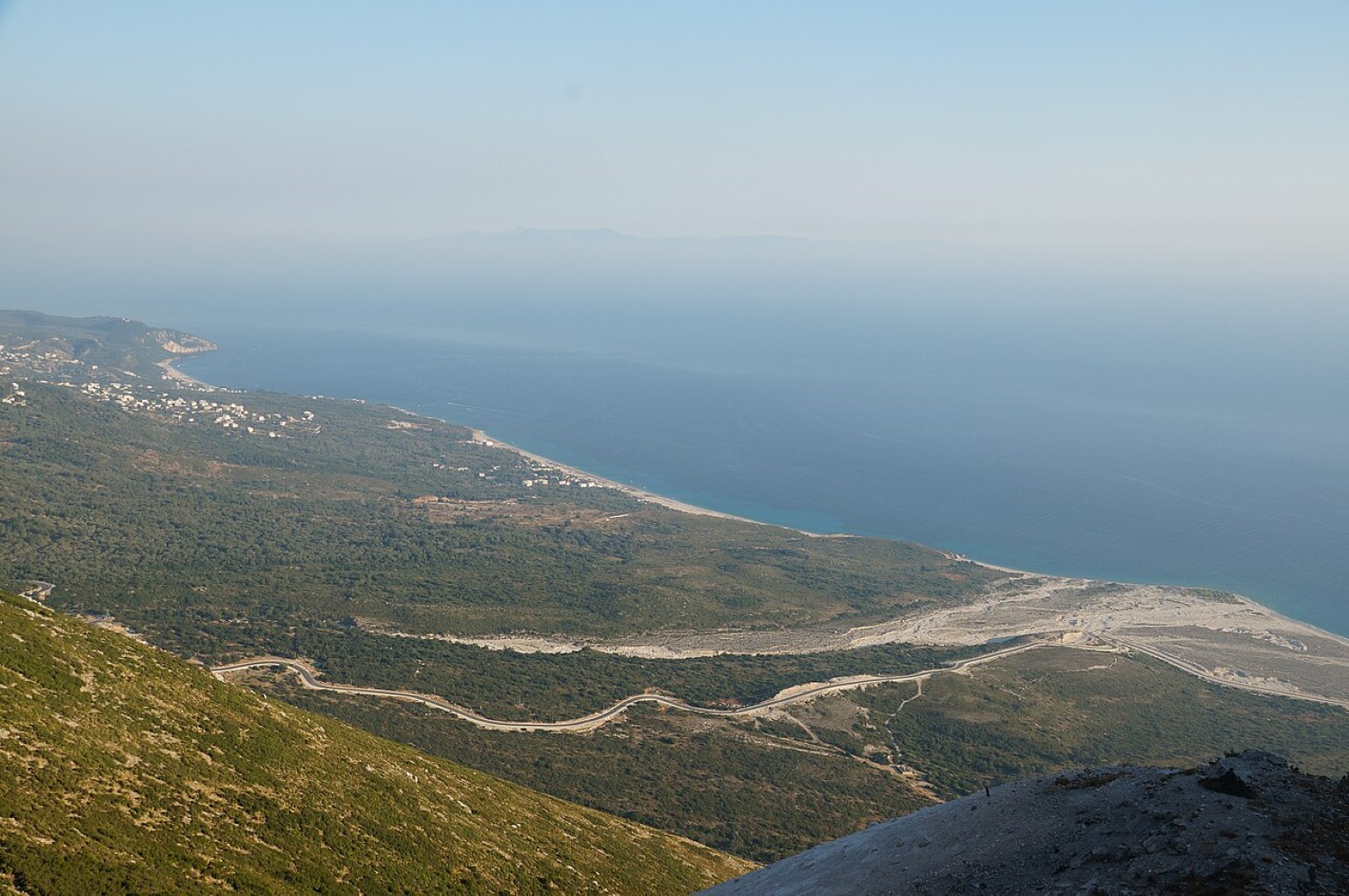 Drymades and Palasë beaches Albania — the two pebble coves seen from above with limestone cliffs behind