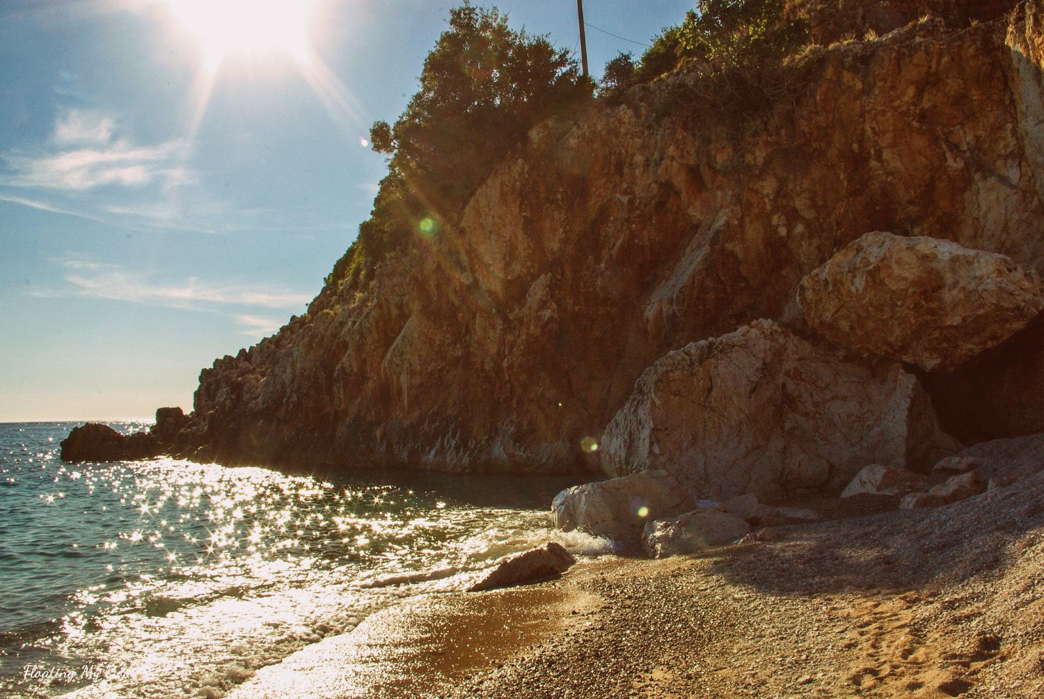 Gjipe Beach Albania — canyon walls framing a turquoise cove at the mouth of the Gjipe Gorge