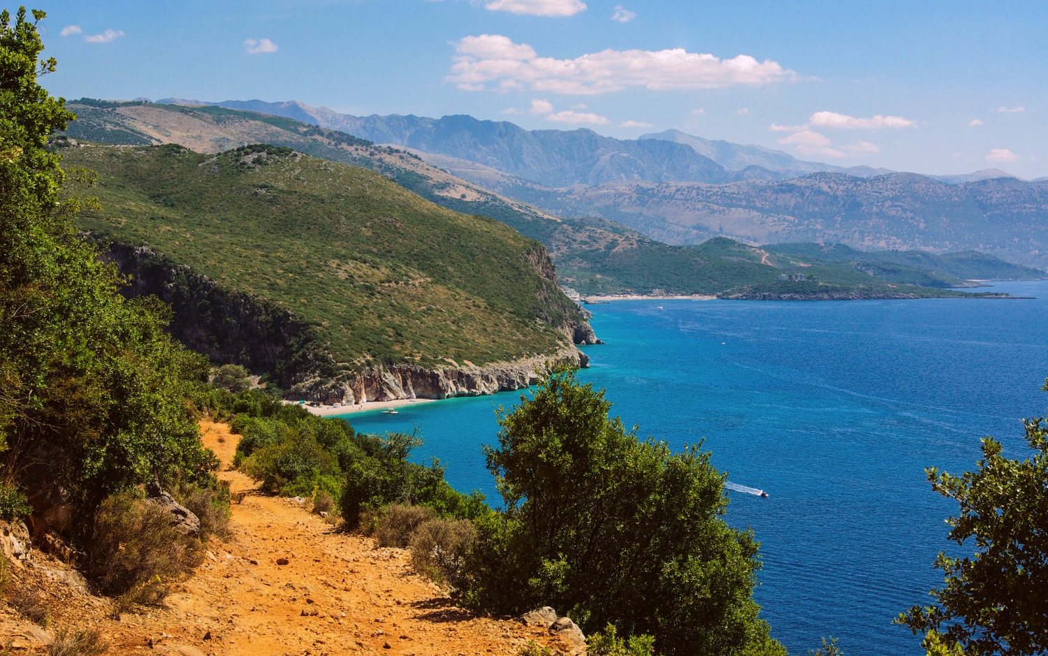 Gjipe Beach Albania — canyon walls rising from the turquoise water at the cove entrance