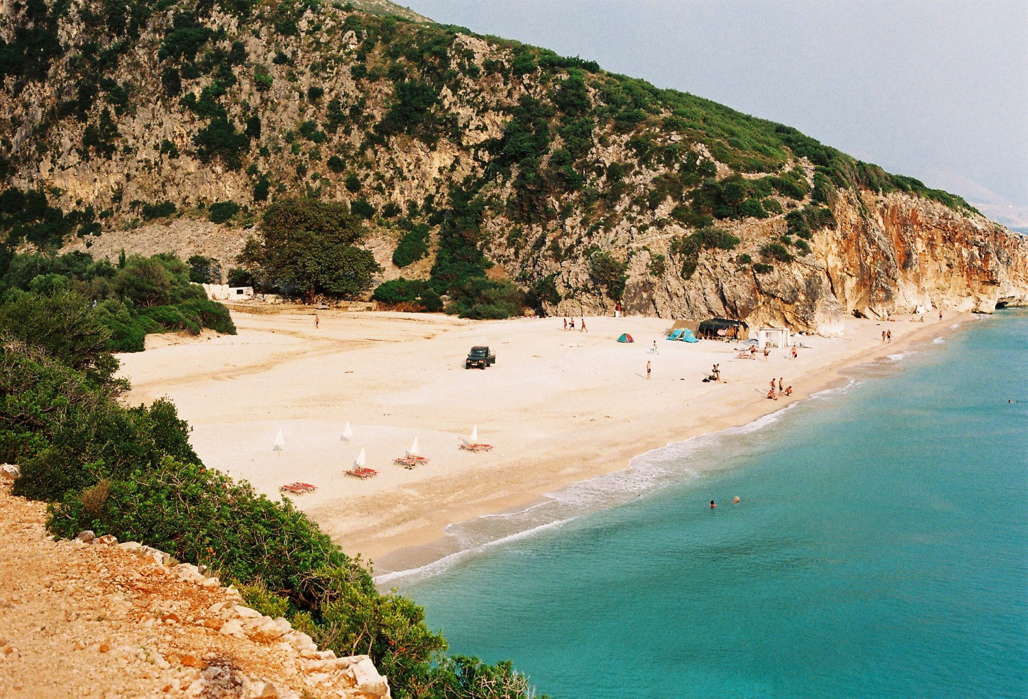 Gjipe Beach Albania — view from above showing the canyon mouth meeting the Ionian Sea