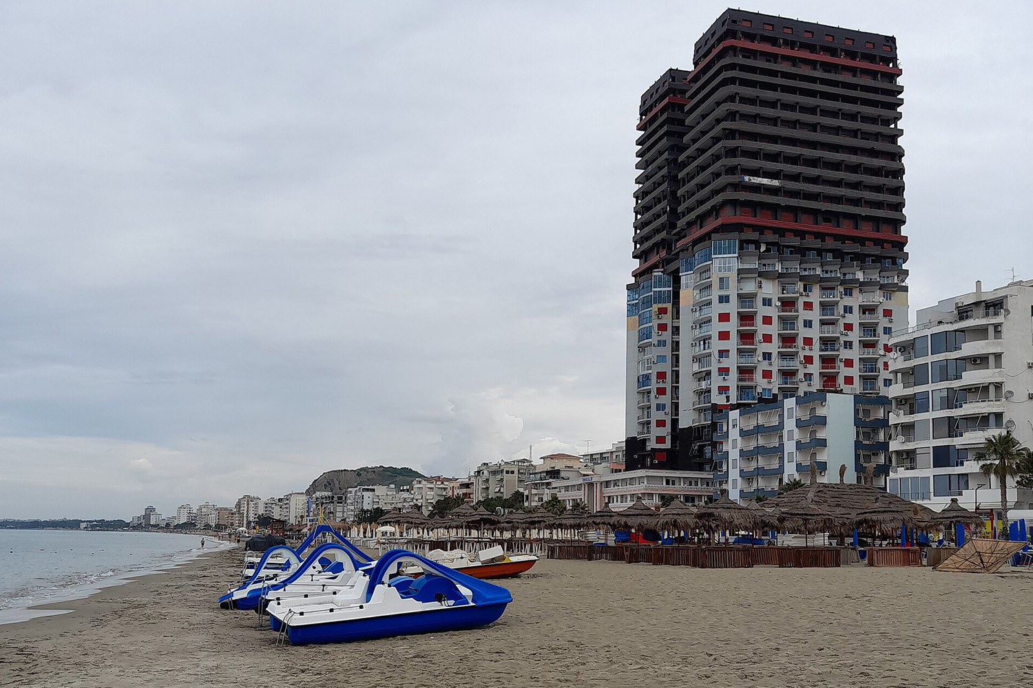 Golem Beach Albania — long sandy Adriatic beach south of Durrës with promenade and resort strip