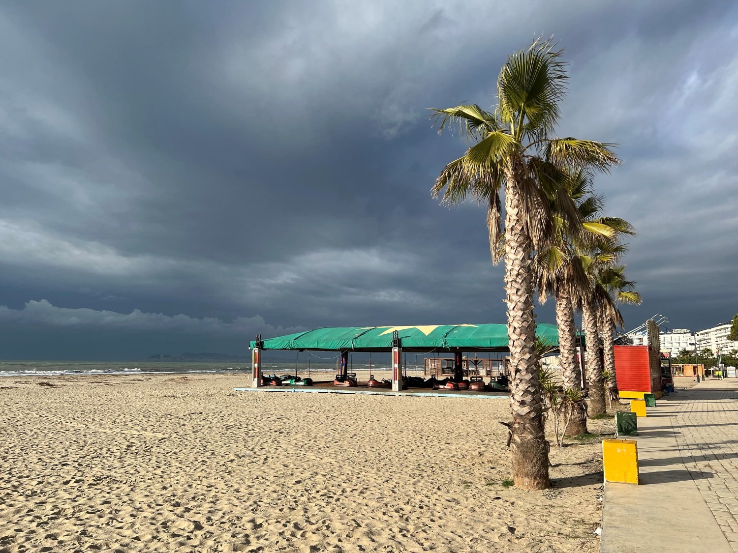 Golem Beach Albania — sandy shore and Adriatic water with beach resort infrastructure